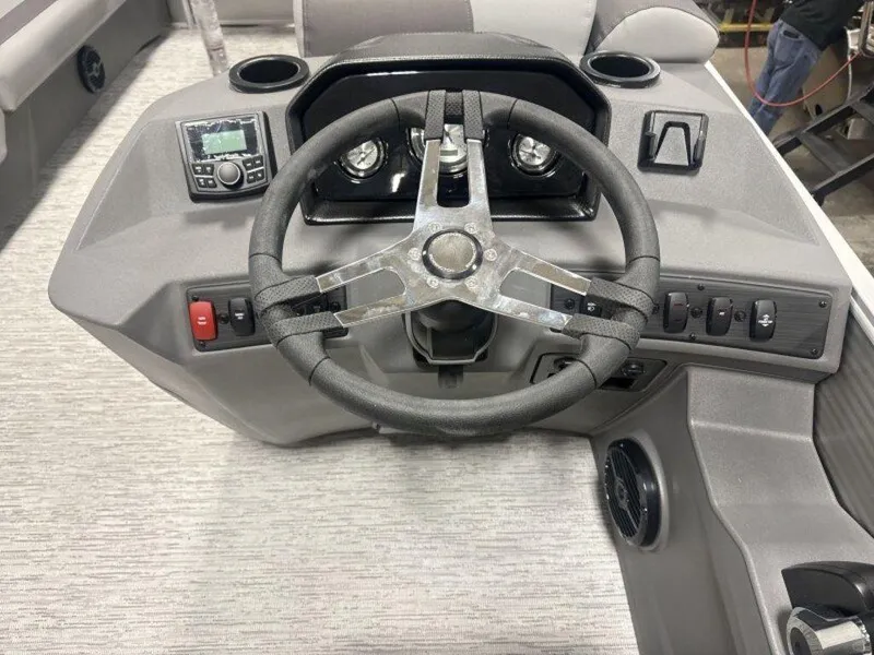 Slide: The Image of 2025 Bennington S Swingback 22 SSB steering console with modern controls and sleek design. - 6