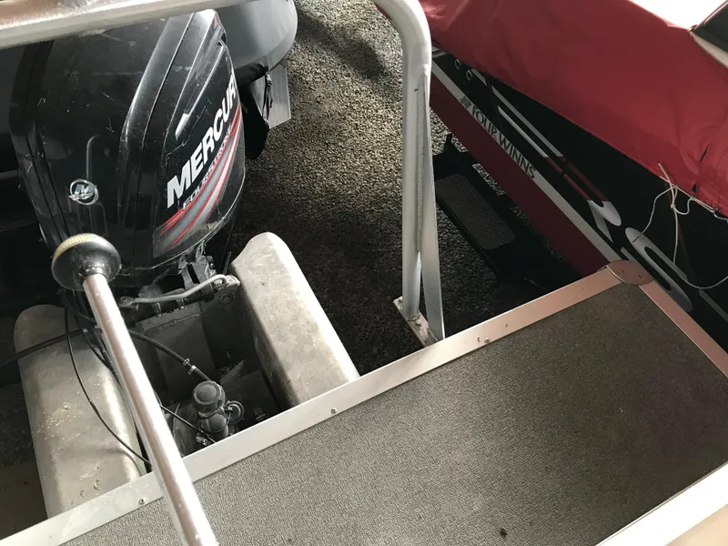 Slide: The Image of 2017 Sun Tracker Party Barge 22 DLX with Mercury outboard motor, docked and covered. - 11