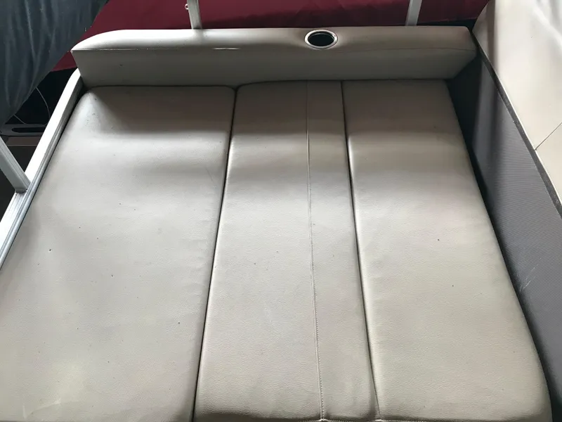 Slide: The Image of Sun Tracker Party Barge 22 DLX 2017 boat seating area with cup holder. - 12