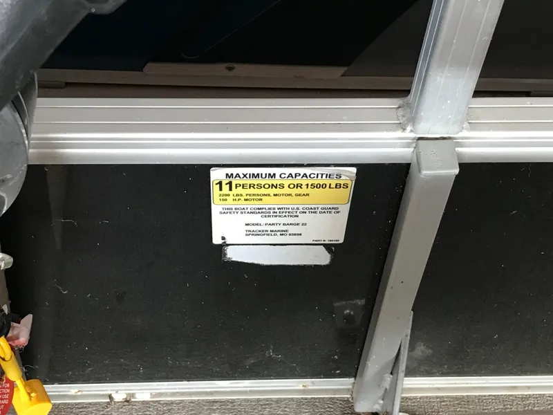 Slide: The Image of 2017 Sun Tracker Party Barge 22 DLX capacity label, maximum 11 persons or 1500 lbs. - 15