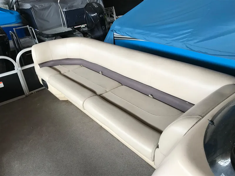 Slide: The Image of 2017 Sun Tracker Party Barge 22 DLX interior seating, beige upholstery, spacious and comfortable design. - 17