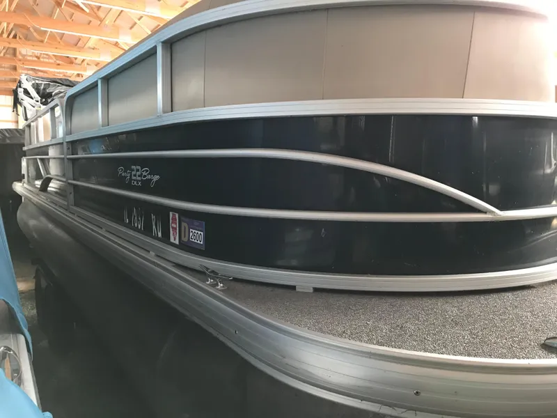 Slide: The Image of 2017 Sun Tracker Party Barge 22 DLX pontoon boat in storage. - 3