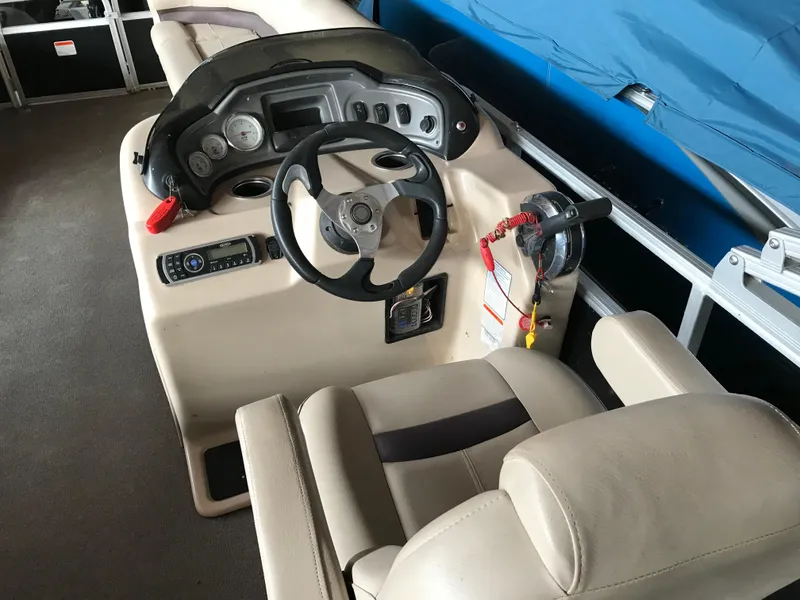 Slide: The Image of 2017 Sun Tracker Party Barge 22 DLX helm with steering wheel and controls. - 5