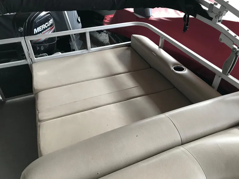 Slide: The Image of 2017 Sun Tracker Party Barge 22 DLX with beige seating and Mercury outboard motor. - 7