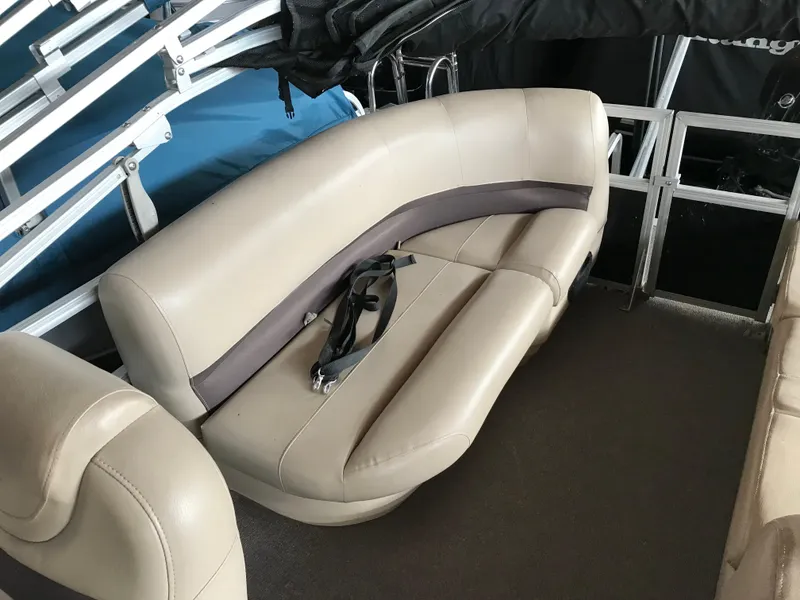 Slide: The Image of 2017 Sun Tracker Party Barge 22 DLX interior with beige seating and black accents. - 8