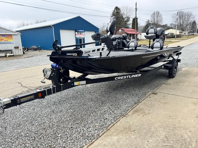 Slide: The Image of 2025 Crestliner XF189 fishing boat on trailer, parked outdoors. - 10