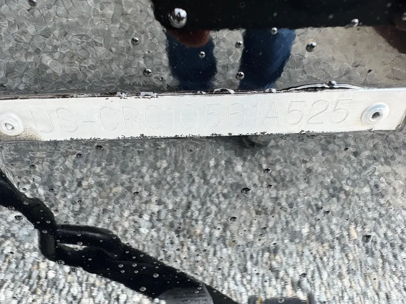 Slide: The Image of 2025 Crestliner XF189 boat hull identification number plate with raindrops. - 4