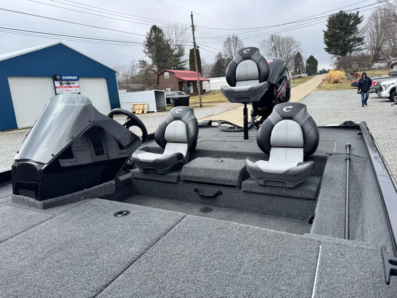 Slide: The Image of 2025 Crestliner XF189 boat with dual seats and steering console, parked outdoors. - 9