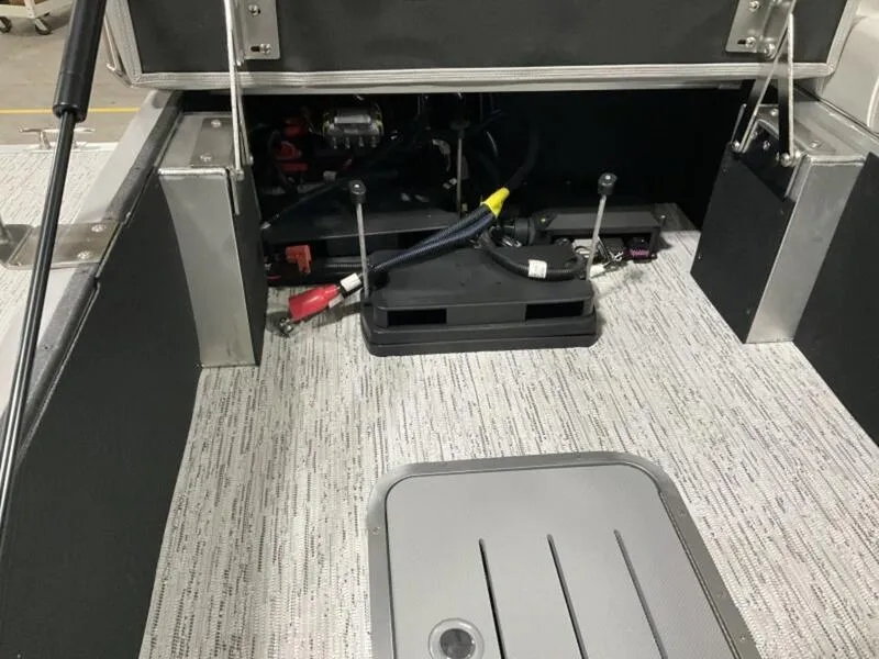 Slide: The Image of 2025 Bennington R Swingback 25 RSB interior showing engine compartment and flooring details. - 13