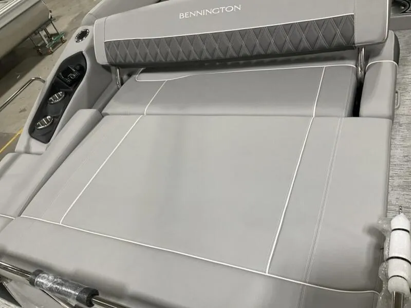 Slide: The Image of 2025 Bennington R Swingback 25 RSB boat seat with gray upholstery and cup holders. - 14