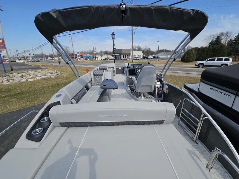 Slide: The Image of 2025 Bennington R Swingback 25 RSB pontoon boat with spacious seating and sleek design. - 17