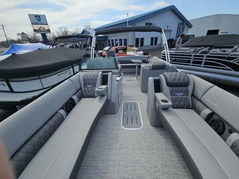 Slide: The Image of 2025 Bennington R Swingback 25 RSB pontoon boat with luxurious seating and modern design. - 7