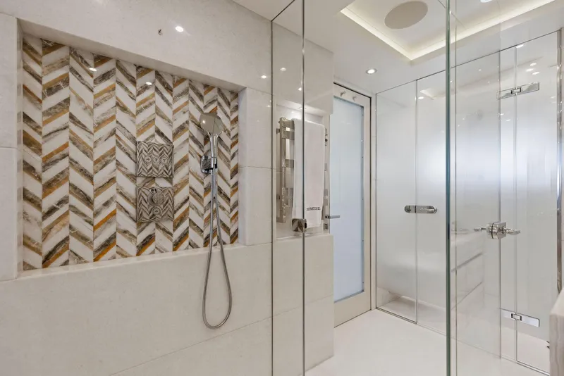 Slide: The Image of Luxurious Bilgin 156 yacht bathroom with glass shower and elegant tile design, 2019 model. - 19