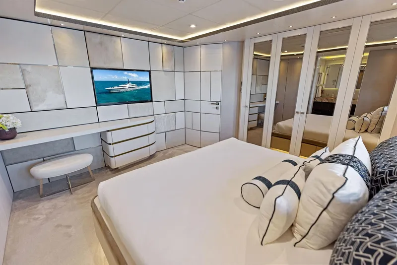 Slide: The Image of Luxurious bedroom interior on Bilgin 156 yacht, featuring modern design and elegant furnishings. - 22