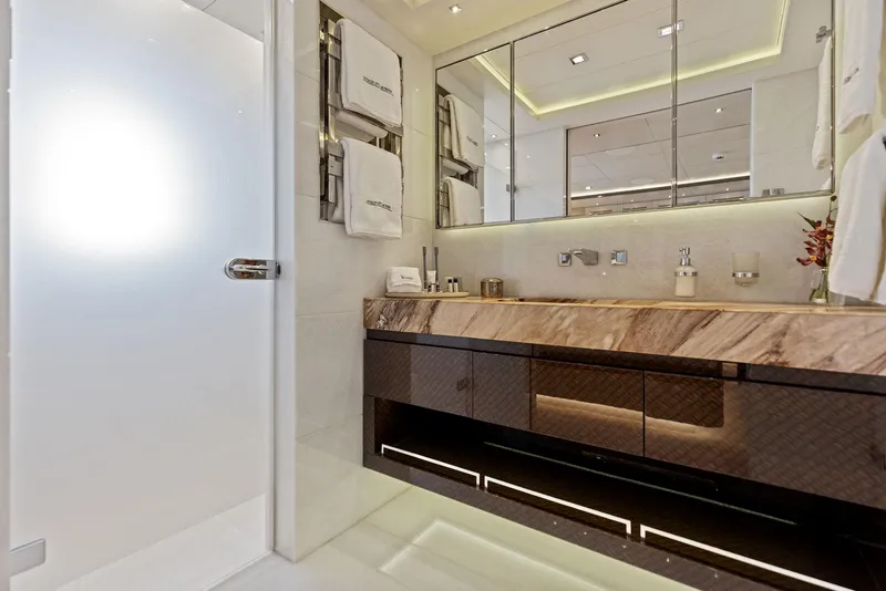 Slide: The Image of Luxurious bathroom interior on Bilgin 156 yacht, featuring elegant marble countertop and modern fixtures. - 23