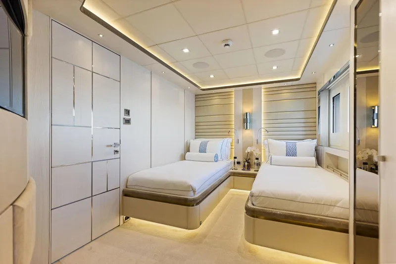 Slide: The Image of Luxurious Bilgin 156 yacht bedroom interior with twin beds, modern lighting, and elegant decor. - 28