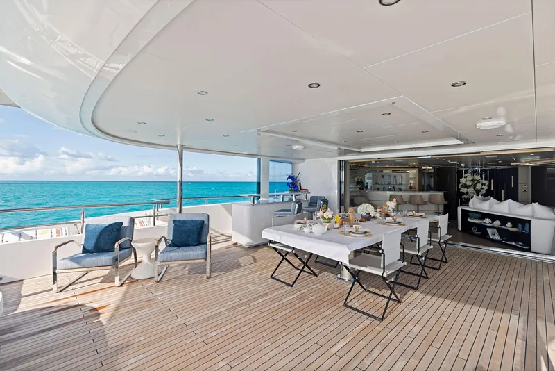 Slide: The Image of Luxurious Bilgin 156 yacht deck with dining area, ocean view, and elegant seating, 2019 model. - 39