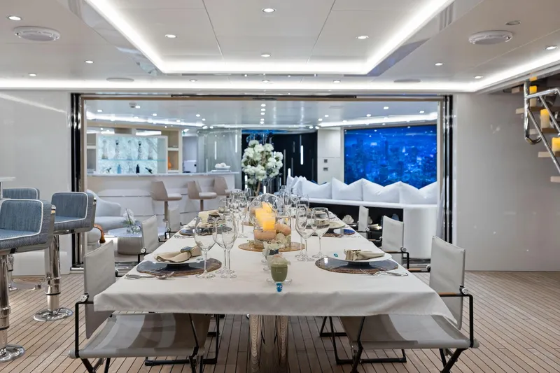 Slide: The Image of Luxurious dining area on 2019 Bilgin 156 yacht, featuring elegant table settings and modern interior design. - 43