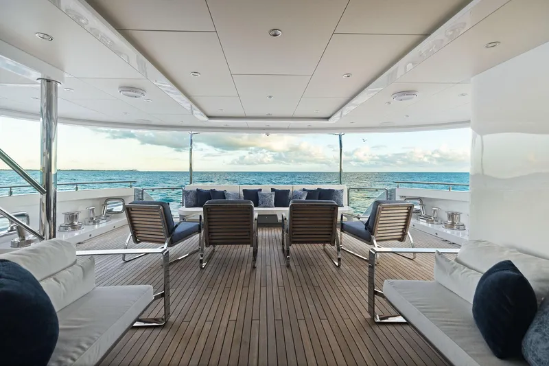 Slide: The Image of Luxurious Bilgin 156 yacht deck with ocean view, featuring elegant seating, 2019 model. - 9