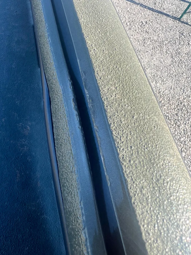 Slide: The Image of Close-up of 2025 SeaArk 1960 Slayer Pro boat surface texture. - 8