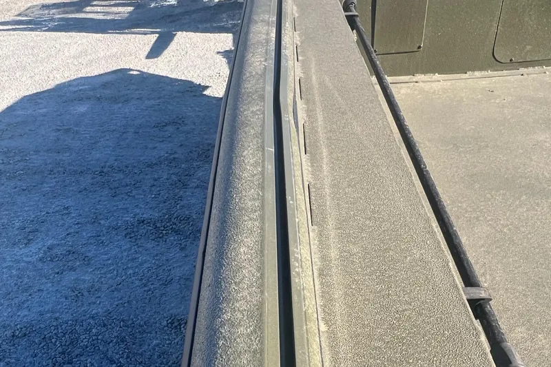 Slide: The Image of 2025 SeaArk 1960 Slayer Pro boat deck with textured surface detail. - 9