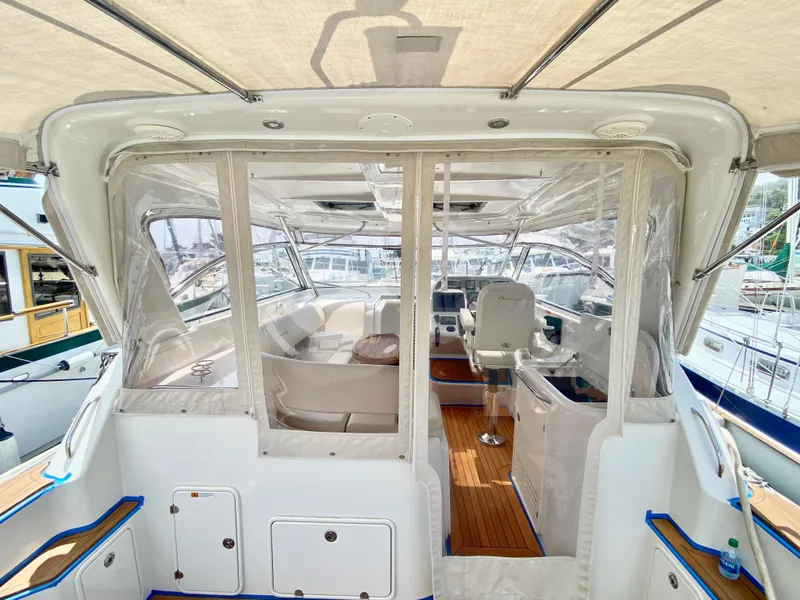 Slide: The Image of 2007 Chris-Craft Roamer 40 yacht interior with helm, seating, and clear enclosures. - 17