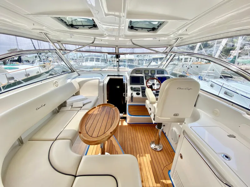 Slide: The Image of Luxurious 2007 Chris-Craft Roamer 40 yacht interior with elegant seating and wooden accents. - 18