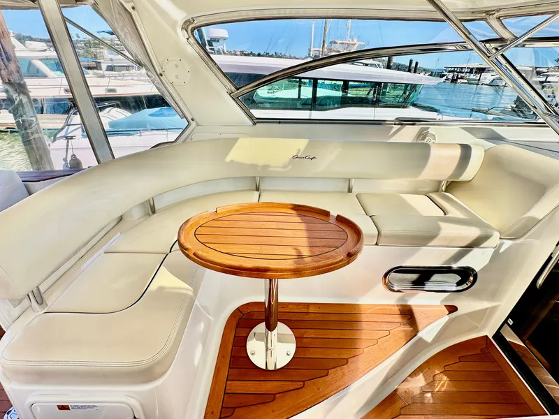 Slide: The Image of Luxurious 2007 Chris-Craft Roamer 40 yacht interior with elegant seating and wooden table. - 19