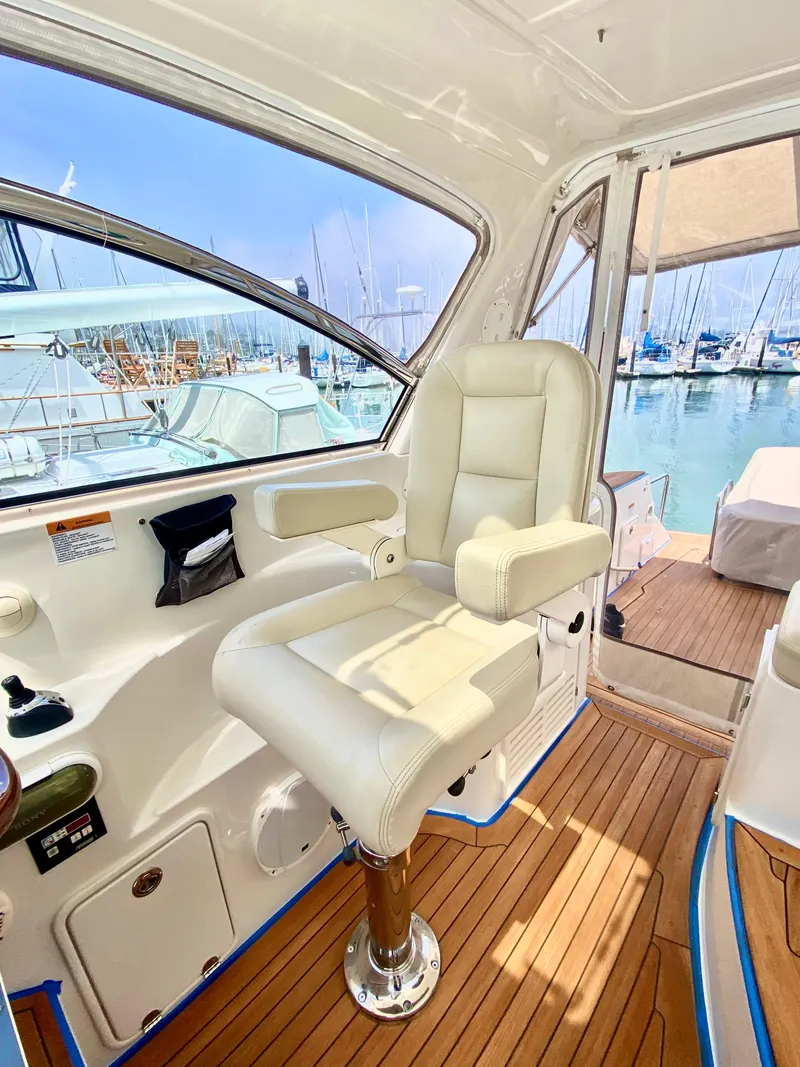 Slide: The Image of Interior of 2007 Chris-Craft Roamer 40 yacht with plush seating and wooden flooring. - 23