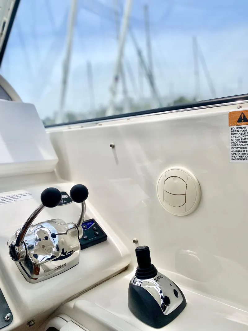 Slide: The Image of Control panel of 2007 Chris-Craft Roamer 40 yacht with throttle and joystick. - 26