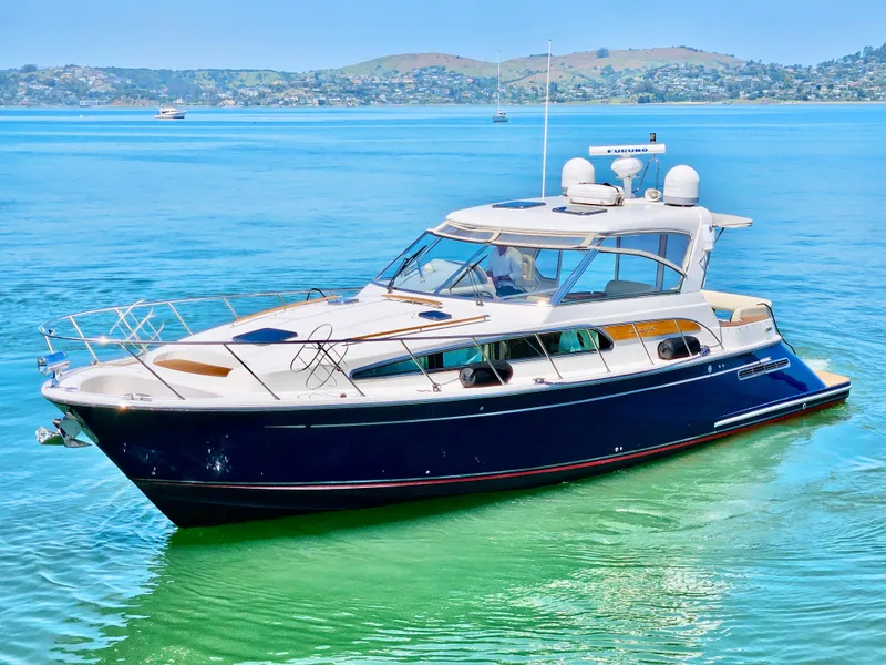 Slide: The Image of 2007 Chris-Craft Roamer 40 yacht on serene blue waters, scenic background. - 3