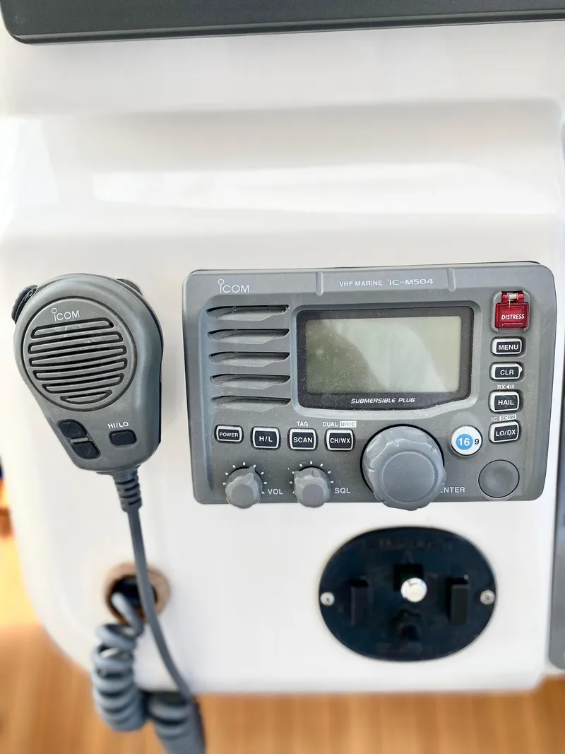 Slide: The Image of 2007 Chris-Craft Roamer 40 marine radio and microphone setup. - 32