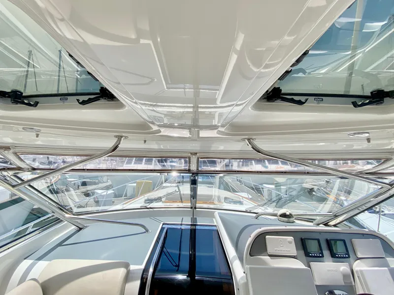 Slide: The Image of 2007 Chris-Craft Roamer 40 yacht interior with sleek dashboard and panoramic windows. - 33