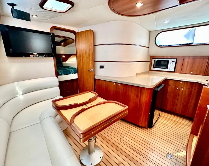 Slide: The Image of Luxurious 2007 Chris-Craft Roamer 40 yacht interior with modern kitchen and cozy seating area. - 35