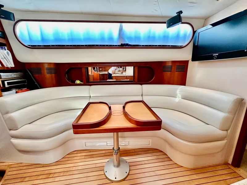 Slide: The Image of Luxurious interior of 2007 Chris-Craft Roamer 40 yacht with elegant seating and wooden table. - 40