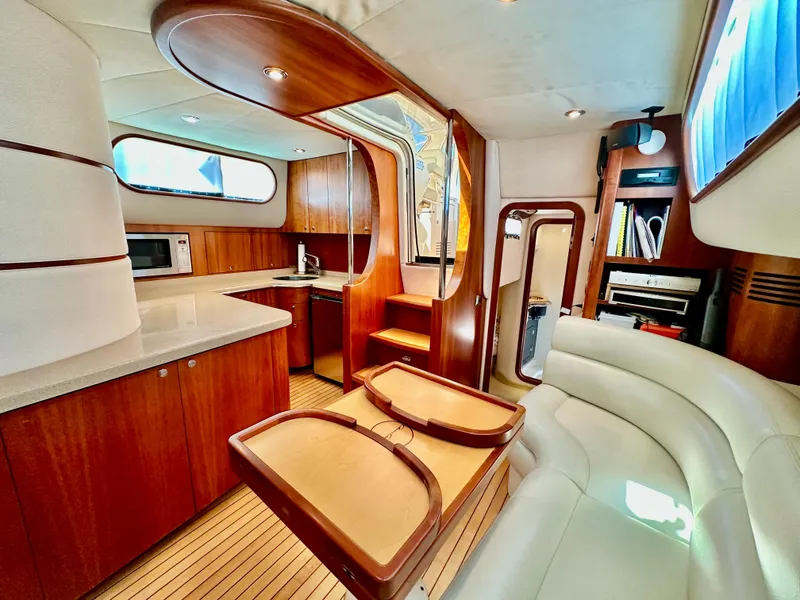 Slide: The Image of Luxurious 2007 Chris-Craft Roamer 40 yacht interior with modern kitchen and elegant seating area. - 42
