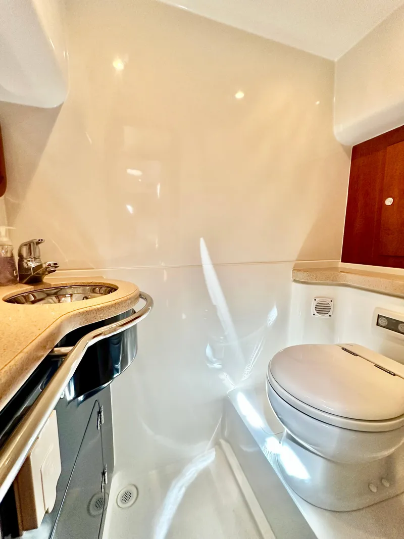 Slide: The Image of Luxurious bathroom in 2007 Chris-Craft Roamer 40 yacht with modern fixtures. - 46