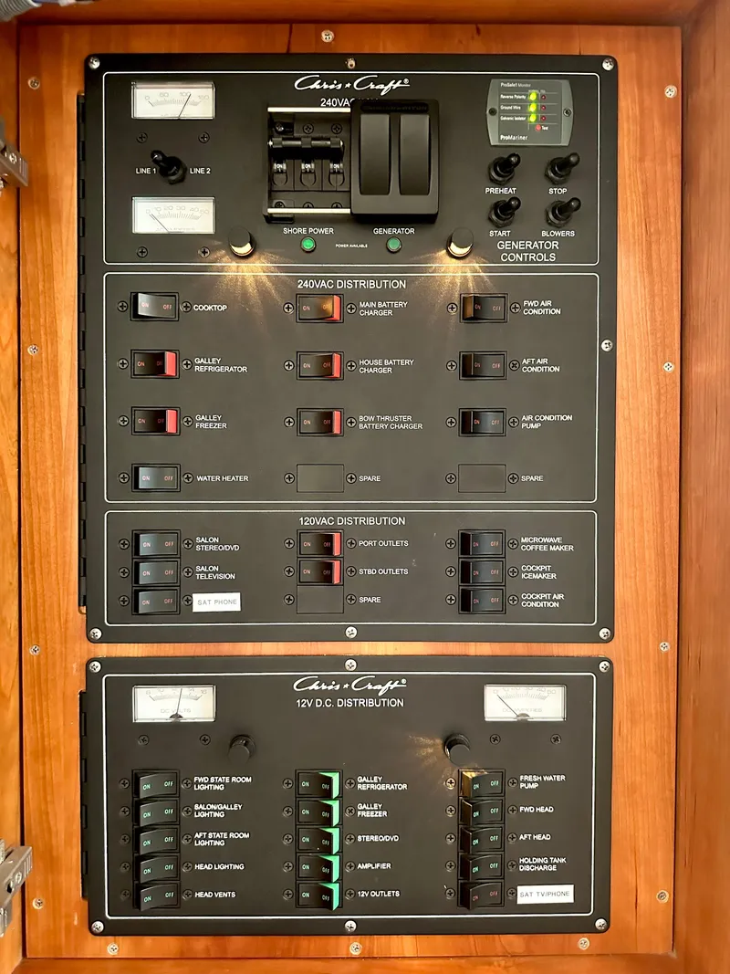 Slide: The Image of Electrical control panel of a 2007 Chris-Craft Roamer 40 boat, featuring switches and indicators. - 48