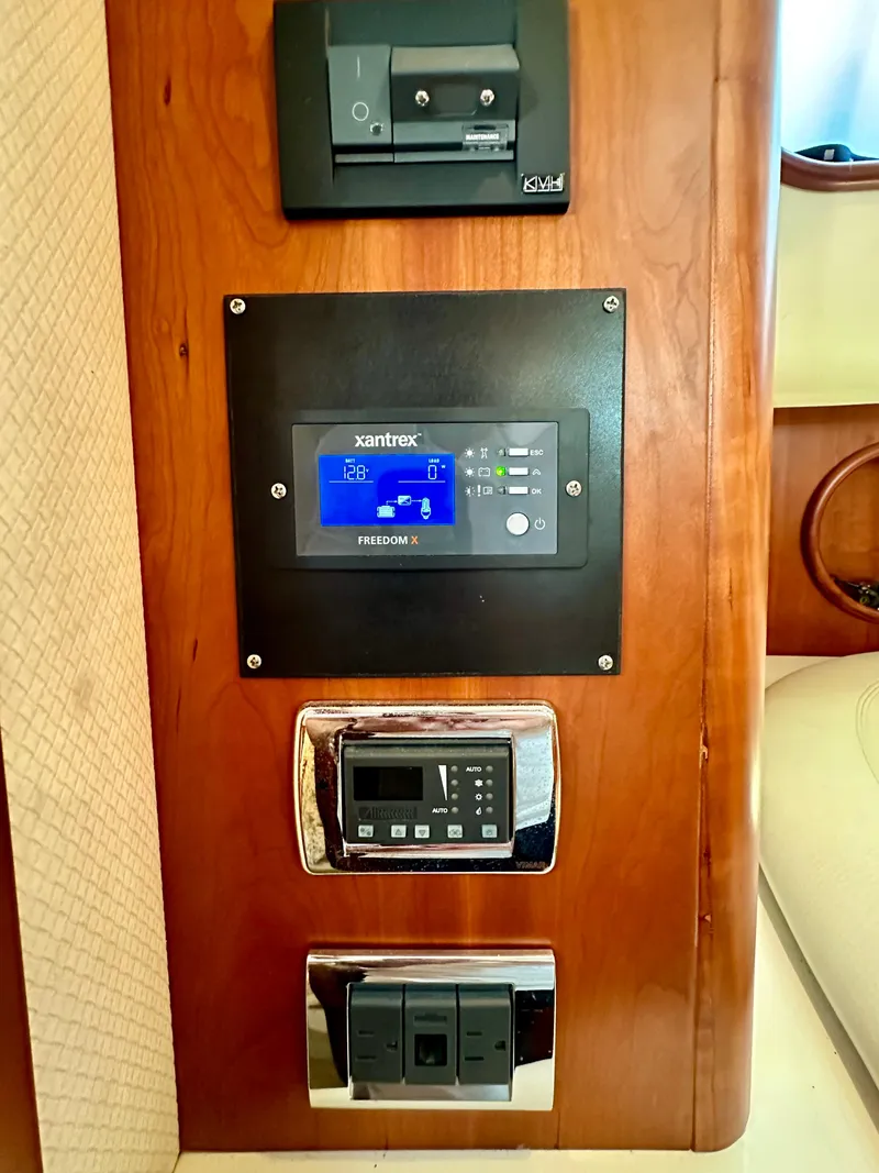 Slide: The Image of Control panel on 2007 Chris-Craft Roamer 40 yacht with Xantrex display and switches. - 49