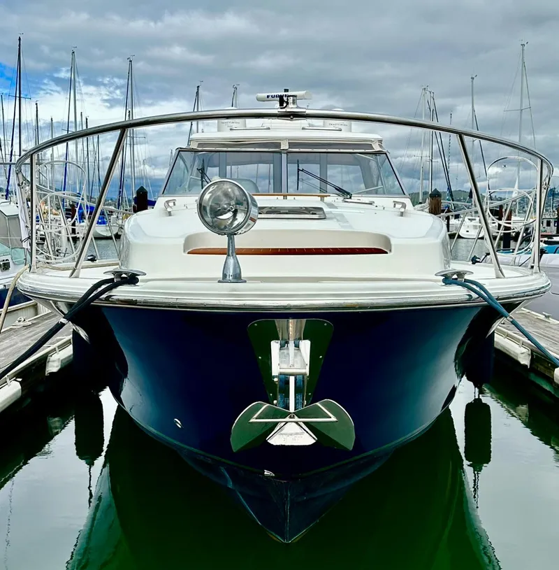 Slide: The Image of 2007 Chris-Craft Roamer 40 yacht docked in a marina, front view. - 59