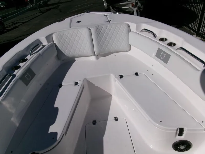 Slide: The Image of 2025 Sea Fox 248 Commander boat interior with white seating and storage compartments. - 10