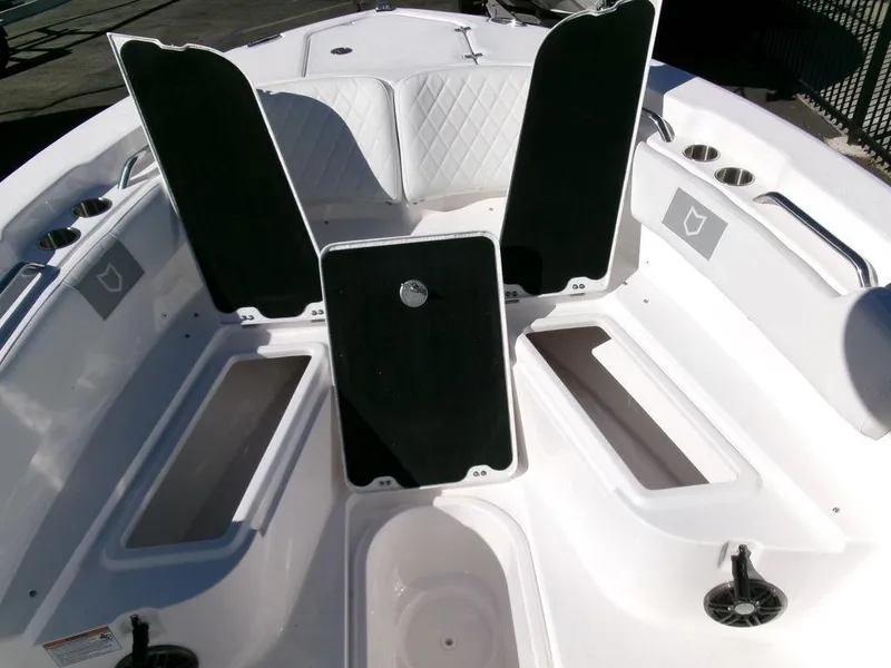 Slide: The Image of 2025 Sea Fox 248 Commander boat interior with open storage compartments and seating. - 11