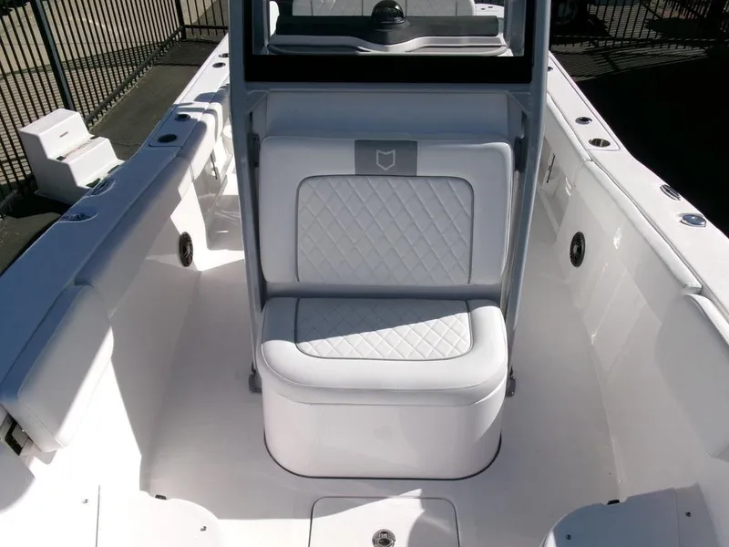 Slide: The Image of 2025 Sea Fox 248 Commander boat interior with cushioned seating and sleek design. - 12