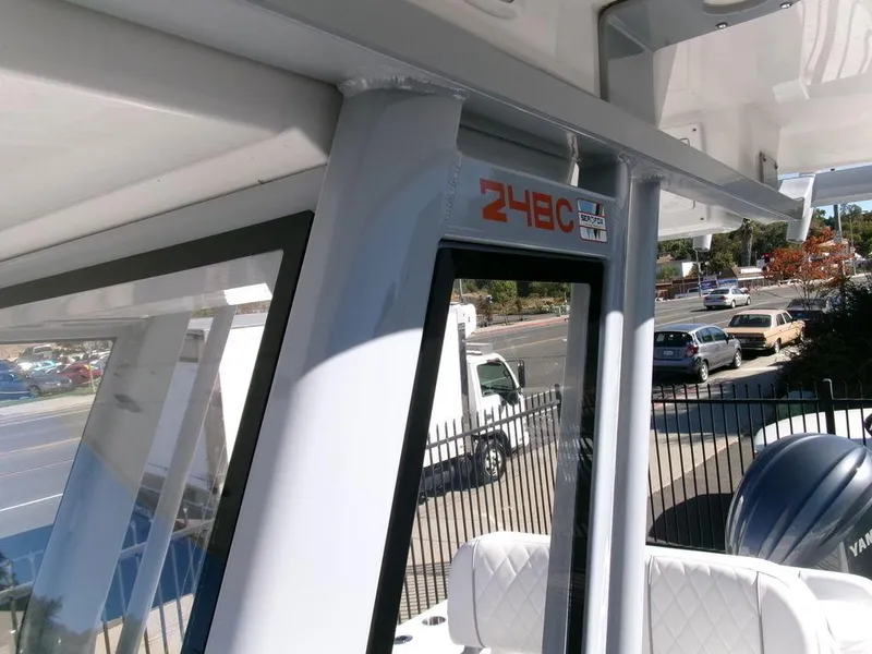 Slide: The Image of 2025 Sea Fox 248 Commander boat interior with seating and window view. - 16