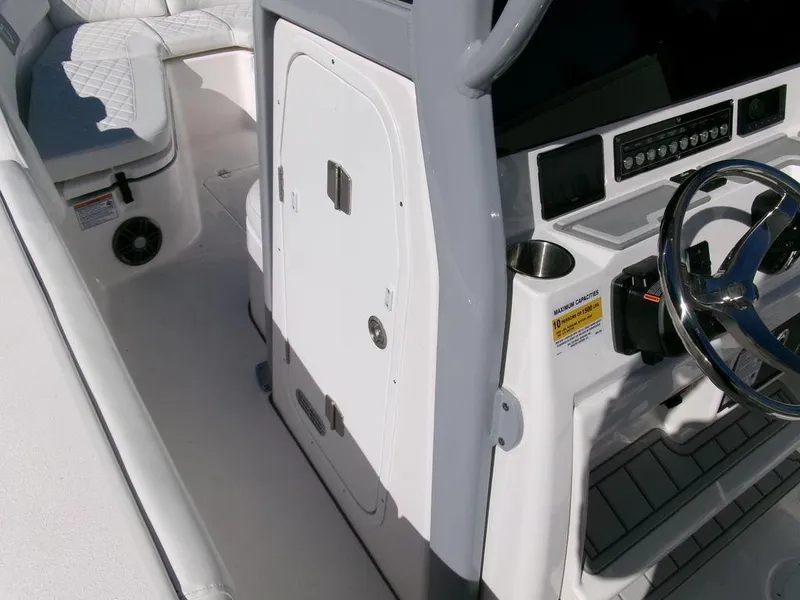 Slide: The Image of 2025 Sea Fox 248 Commander boat interior with steering wheel and seating area. - 17