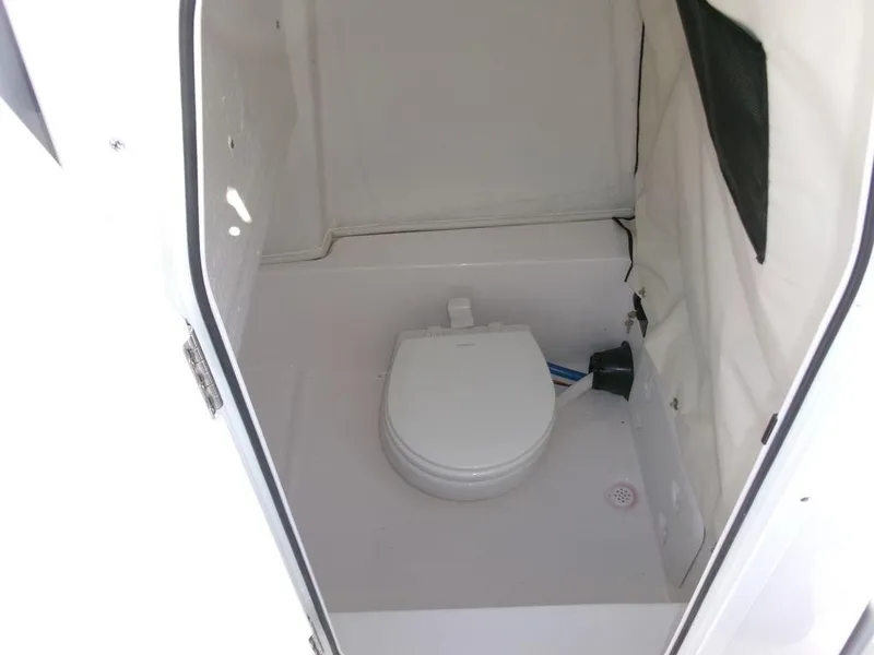 Slide: The Image of 2025 Sea Fox 248 Commander boat interior with a compact marine toilet. - 19