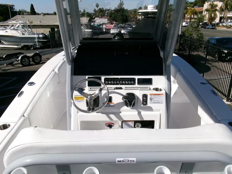 Slide: The Image of 2025 Sea Fox 248 Commander boat cockpit with steering wheel and control panel. - 20