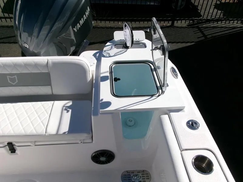 Slide: The Image of 2025 Sea Fox 248 Commander boat interior with seating and Yamaha engine. - 32