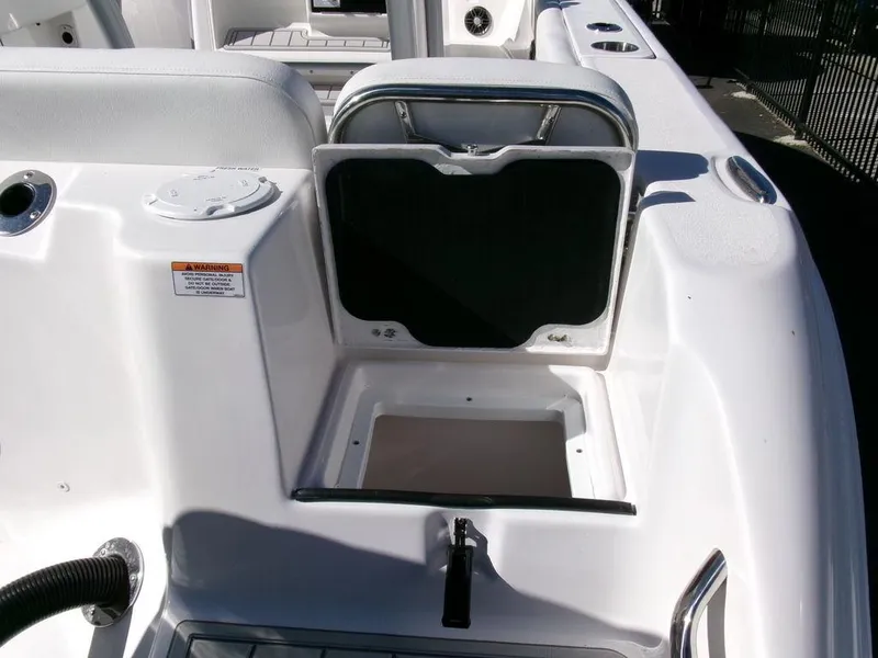 Slide: The Image of 2025 Sea Fox 248 Commander boat storage compartment with open lid. - 34