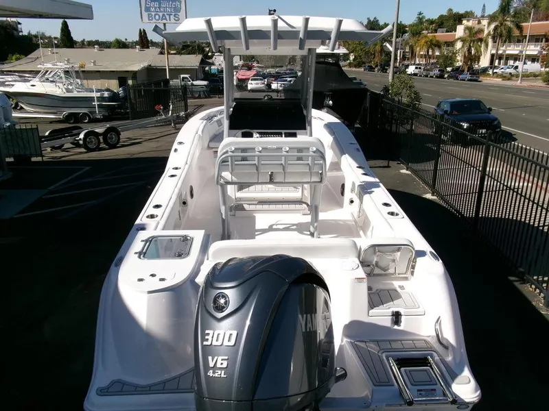 Slide: The Image of 2025 Sea Fox 248 Commander boat with Yamaha 300 V6 engine, parked outdoors. - 37